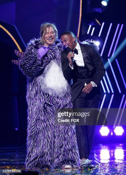 Mickey Rourke and host Nick Cannon in the "Six More Masks" episode of THE MASKED SINGER airing Wednesday, Sept. 30 on FOX.