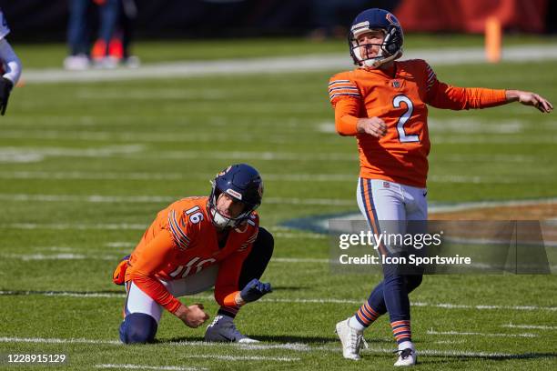 Chicago Bears Punter Pat O'Donnell and Chicago Bears Place Kicker Cairo Santos look on after practicing a field goal kick prior to a NFL game between...