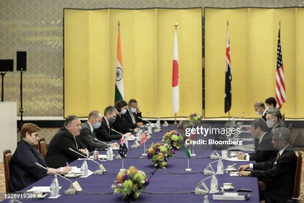 Michael Pompeo, U.S. Secretary of State, second left, speaks to Toshimitsu Motegi, Japan's foreign minister, second right, Subrahmanyam Jaishankar,...