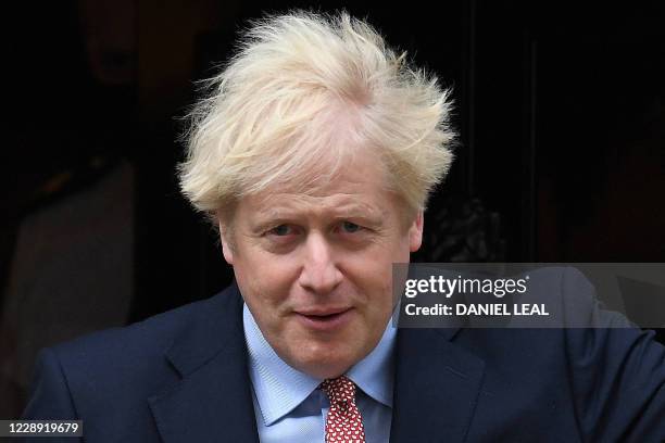 Britain's Prime Minister Boris Johnson leaves 10 Downing Street in central London on October 6 before giving a speech to the Conservative Party's...