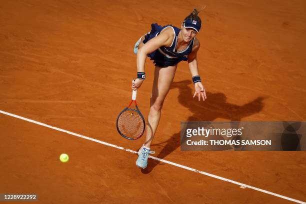 Argentina's Nadia Podoroska serves the ball to Ukraine's Elina Svitolina during their women's singles quarter-final tennis match on Day 10 of The...