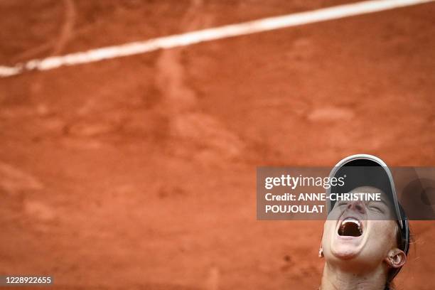 Argentina's Nadia Podoroska celebrates after winning against Ukraine's Elina Svitolina during their women's singles quarter-final tennis match on Day...