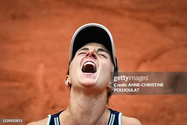 Argentina's Nadia Podoroska celebrates after winning against Ukraine's Elina Svitolina during their women's singles quarter-final tennis match on Day...