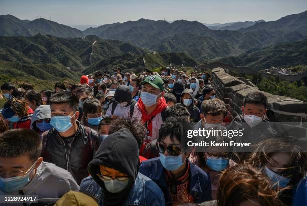 Chinese tourists crowd in a bottleneck as they move slowly on a section of the Great Wall at Badaling after tickets sold out during the 'Golden Week'...