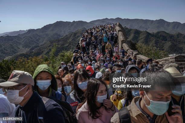 Chinese tourists crowd in a bottleneck as they move slowly on a section of the Great Wall at Badaling after tickets sold out during the 'Golden Week'...