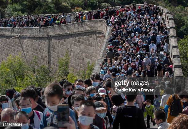 Chinese tourists crowd in a bottleneck as they move slowly on a section of the Great Wall at Badaling after tickets sold out during the 'Golden Week'...