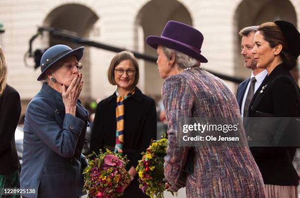 Queen Margrethe of Denmark sends a kiss to her sister, Princess Benedikte, while Crown Princess Mary and Crown Prince Frederik look on during the...