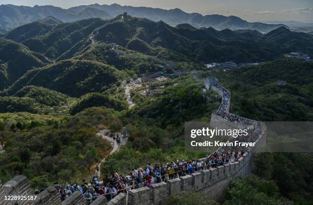 Chinese tourists walk on a crowded section of the Great Wall at Badaling after tickets sold out during the 'Golden Week' holiday on October 4, 2020...