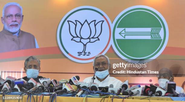 Bihar Chief Minister and JDU leader Nitish Kumar and Deputy CM Sushil Kumar Modi during a press conference on seat-sharing arrangement with the NDA...