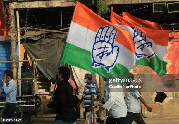 Congress party Supporters with party flags walk in a rally protesting in opposition to atrocities against women in Utaar Pradesh and all over the...