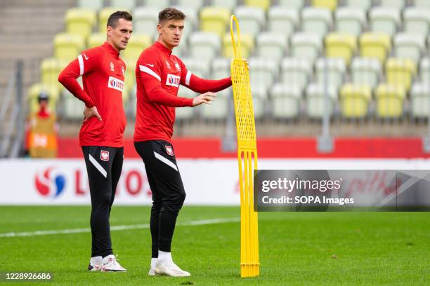 Arkadiusz Milik and Krzysztof Piatek in action during the official training session one day before the international football friendly match between...