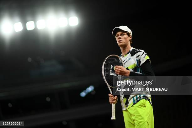 Italy's Jannik Sinner reacts as he plays against Spain's Rafael Nadal during their men's singles quarter-final tennis match on Day 10 of The Roland...