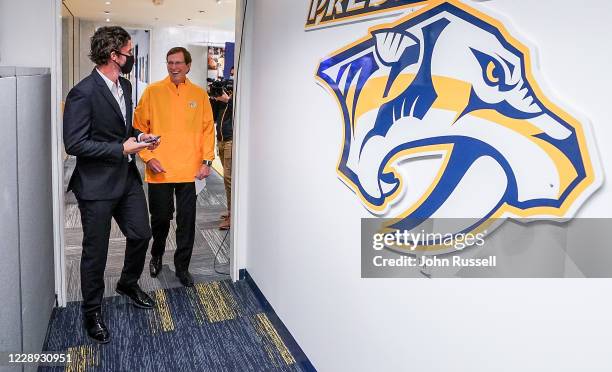 Nashville Predators GM David Poile shares a laugh with team captain Roman Josi after announcing goalie Yaroslav Askarov as the 11th pick overall...