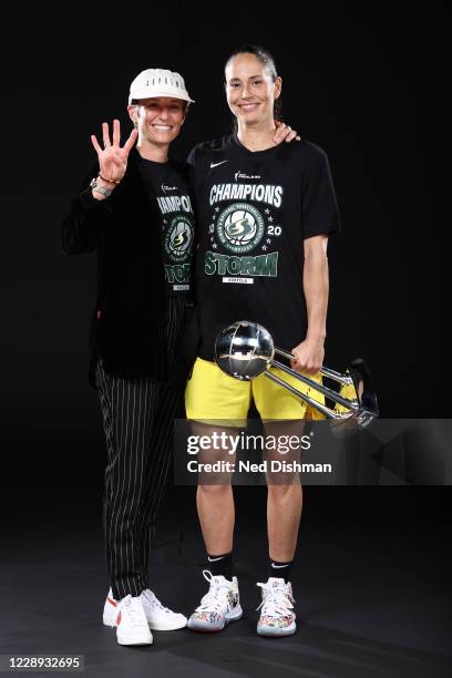 Megan Rapinoe and Sue Bird of the Seattle Storm poses for a portrait with the WNBA Championship Trophy after winning Game 3 of the 2020 WNBA Finals...