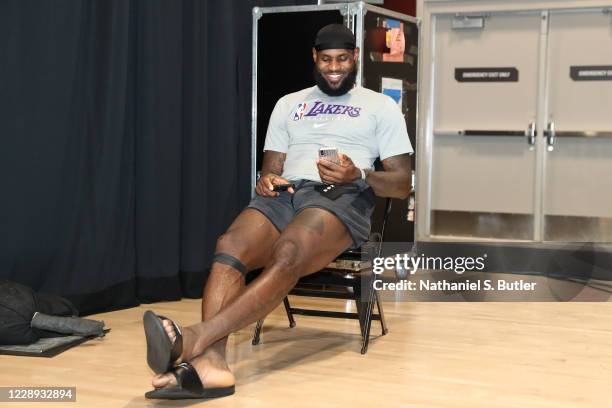 LeBron James of the Los Angeles Lakers talks on FaceTime after Game Four of the NBA Finals on October 6, 2020 at AdventHealth Arena in Orlando,...