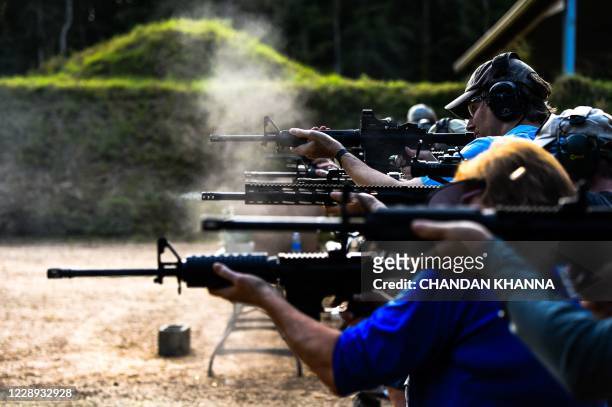 Students fire AR-15 semi-automatic rifles during a shooting course at Boondocks Firearms Academy in Jackson, Mississippi on September 26, 2020. -...