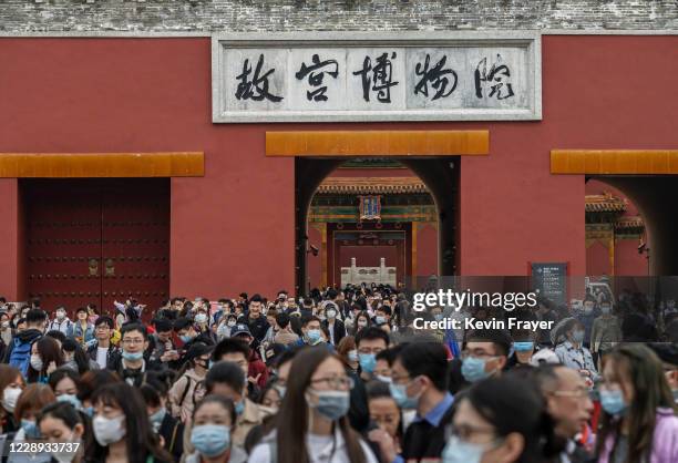 Chinese tourists crowd as they leave the exit of the Forbidden City on October 6, 2020 after tickets sold out during the 'Golden Week' holiday in...