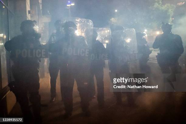 Federal officers disperse a crowd of protesters on October 6, 2020 in Portland, Oregon. Federal officers and Portland police responded with arrests...