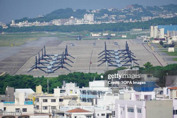 Ospreys are seen amidst heat haze on the runway of the U.S. Marine Corps Air Station Futenma.