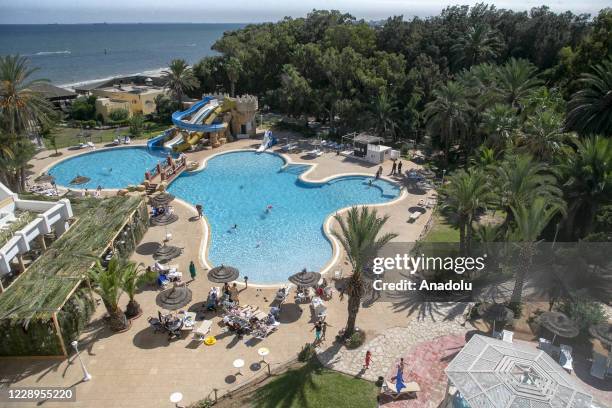 Tourists enjoy the sunny day at pools and the beach in Sousse, Tunisia on October 8, 2020. Tunisia's tourism center, Sousse, is a holiday place where...