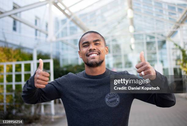 Munich, GERMANY Newly signed player Douglas Costa of FC Bayern Muenchen poses at the General Aviation Terminal at Munich Airport on October 8, 2020...