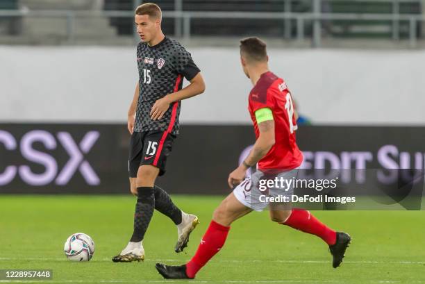 Mario Pasalic of Croatia and Granit Xhaka of Switzerland battle for the ball during the international friendly match between Switzerland and Croatia...