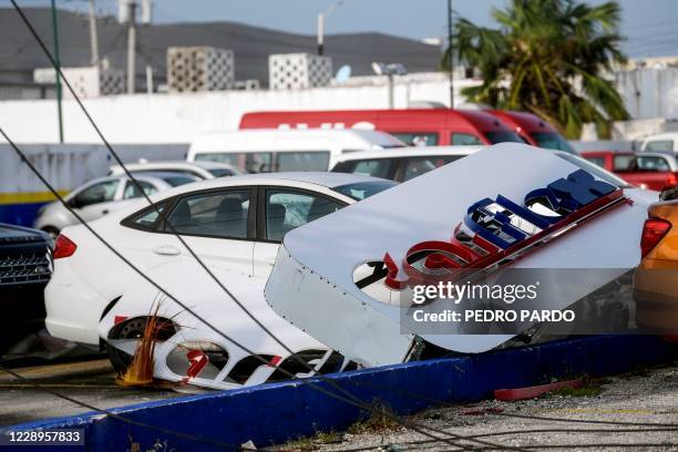 Car remains under a fallen metal sign, following the passage of Hurricane Delta in Cancun, Quintana Roo state, Mexico, on October 8, 2020. -...