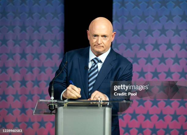 Democratic challenger Mark Kelly prepares to debate U.S. Sen. Martha McSally, R-Ariz. At the Walter Cronkite School of Journalism at Arizona State...