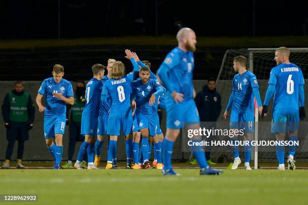 Iceland's players celebrate their second goal by Iceland's midfielder Gylfi Sigurdsson during the Euro 2020 play-off semi-final football match...