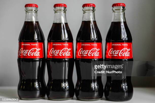 Coca-Cola bottles are seen in this illustration photo taken in Krakow, Poland on October 8, 2020.