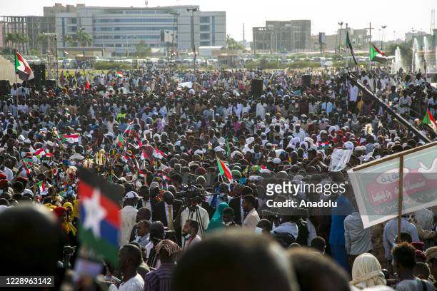 People attend the celebration held at Freedom Square organized by "Sudan People's Initiative to support peace" after signing a peace deal between...