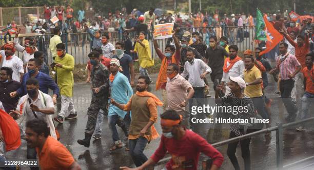 Bharatiya Janata Party supporters march during Nabanna Chalo in front of Howrah Bridge on October 8, 2020 in Kolkata, India. The BJP’s Nabanna Chalo...