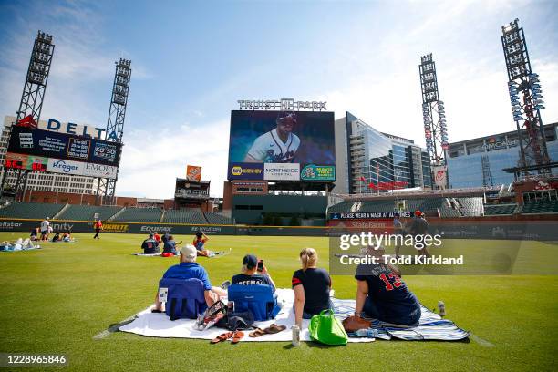 Atlanta Braves fans watch Game Three of the National League Division Series between the Miami Marlins and Atlanta Braves at Truist Park on October 8,...