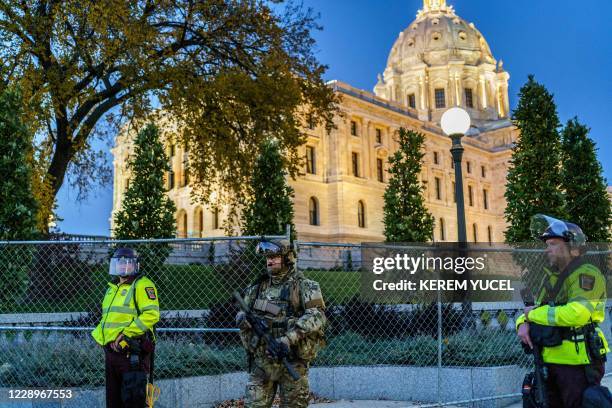 Minnesota State Patrol and National Guard soldiers stand in front of the Minnesota State Capitol building during a demonstration after the release on...