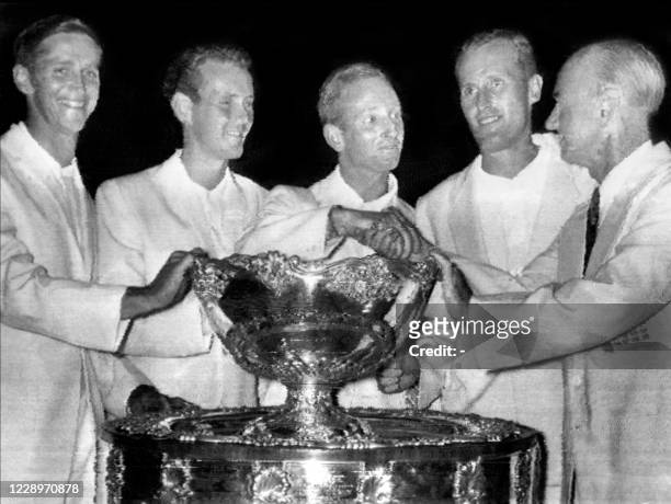 After their victory over Mexico, Australian tennis players Roy Emerson, Ken Fletcher, Rod Laver, Neale Fraser, and captain Harry Hopman, gather on...