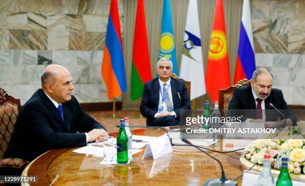 Russian Prime Minister Mikhail Mishustin and Armenian Prime Minister Nikol Pashinyan attend a meeting of the Eurasian Economic Union's...