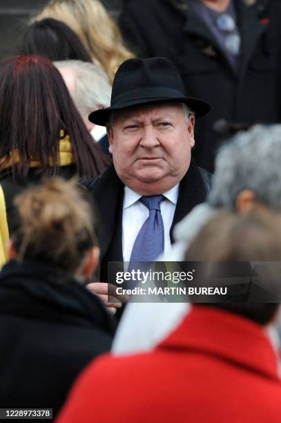 French journalist Gerard Carreyrou leaves Saint-Germain-des-Pres' church, after attending the funeral of French singer Jean-Chrysostome Dolto, a...