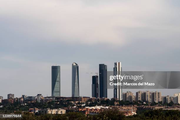 View of Madrid skyline with skyscrapers of the business area. The construction of the Caleido Tower is reaching its completion but has had to...