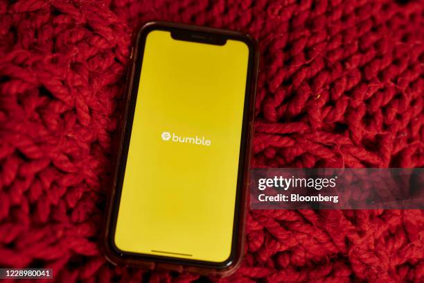 The logo for Bumble is displayed on a smartphone in an arranged photograph taken in the Brooklyn borough of New York, U.S., on Friday, Oct. 9, 2020....