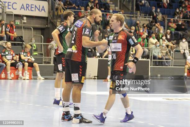 Zeljko Musa and Omar Ingi Magnusson of SC Magdeburgis a celebrates a goal during the LIQUI MOLY Handball-Bundesliga match between SC Magdeburg and...