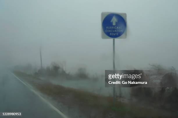 Hurricane evacuation route sign is seen as Hurricane Delta approaches on October 9, 2020 in Cameron, Louisiana. Residents along the Gulf Coast are...