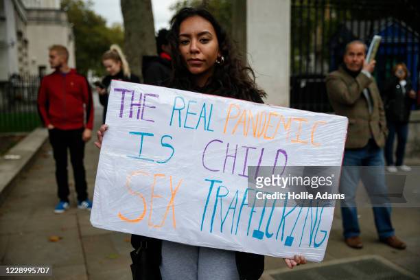 Protestor holds a sign during a "Save our Children" rally outside Downing Street on October 10, 2020 in London, England. During the demonstration,...