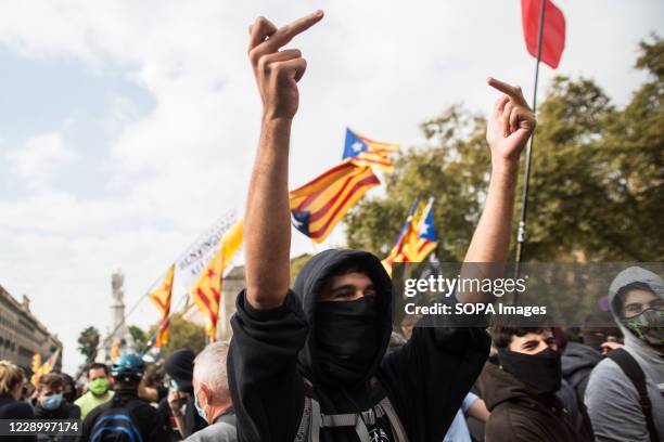 Protester showing his middle finger during the demonstration. Anti-monarchical sympathizers for the independence of Catalonia have gathered due to...