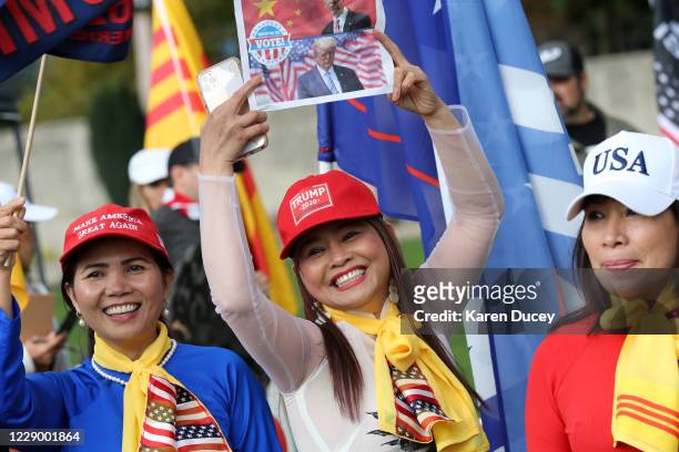 Women from the Asian American community participate in a rally supporting President Donald Trump on October 10, 2020 in Bellevue, Washington. The...