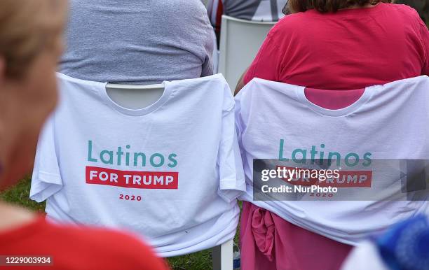 October 10, 2020 - Orlando, Florida, United States - T-shirts placed on chairs by people waiting for U.S. Vice President Mike Pence to arrive to...
