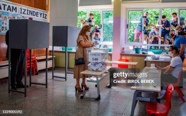 Sibel Tatar, the wife of Turkish-Cypriot Prime Minister of the self-proclaimed Turkish Republic of Northern Cyprus Ersin Tatar, casts her vote as the...