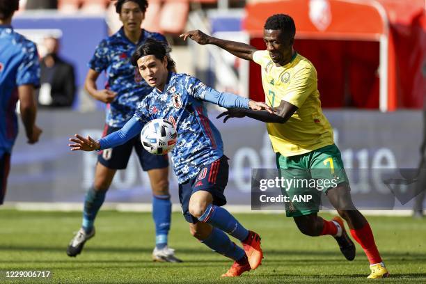 Takumi Minamino of Japan, Samuel Oum Gouet of Cameroon during the friendly match between Japan and Cameroon at Stadion Galgenwaard on October 09,...