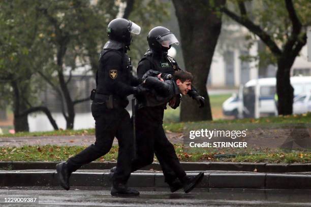 Graphic content / Law enforcement officers detain a man during a rally to protest against the Belarus presidential election results in Minsk on...