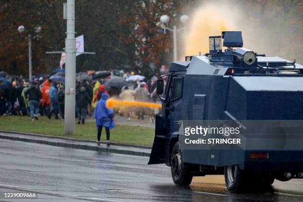 Graphic content / Police use a water cannon truck to disperse demonstrators during a rally to protest against the Belarus presidential election...