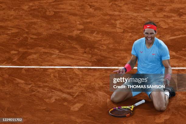 Spain's Rafael Nadal celebrates after winning against Serbia's Novak Djokovic at the end of their men's final tennis match at the Philippe Chatrier...